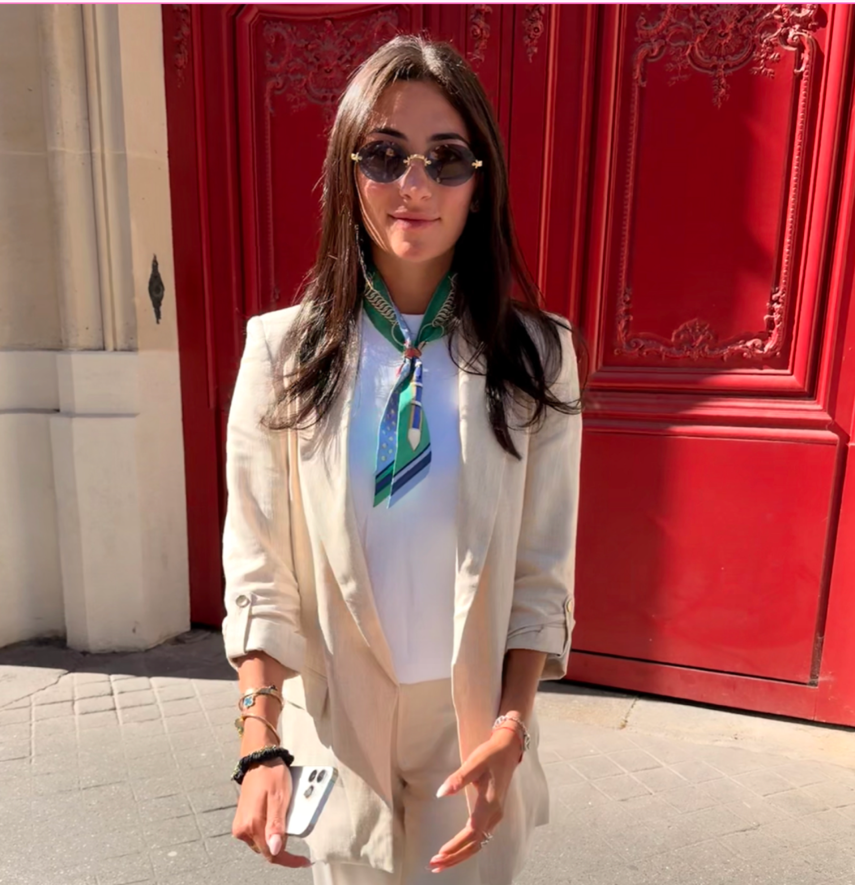 Medical Muse founder in front of a red door